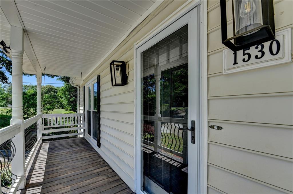 1530 Plunketts Road Buford, GA 30519 - Photo 11 of 54 a view of a house with a deck