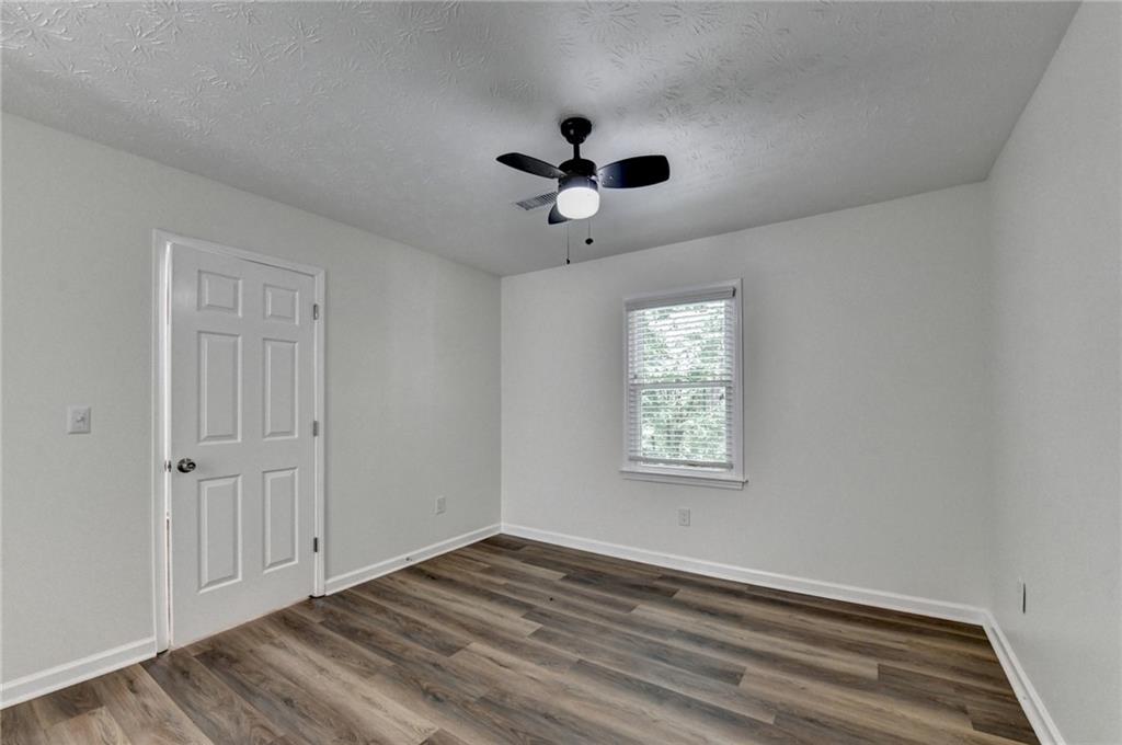 1530 Plunketts Road Buford, GA 30519 - Photo 36 of 54 a view of an empty room with a window