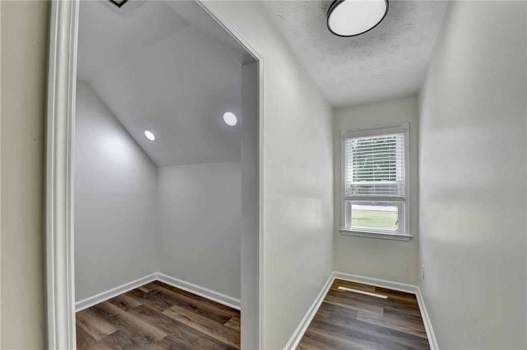 1530 Plunketts Road Buford, GA 30519 - Photo 46 of 54 a view of small space with wooden floor and windows