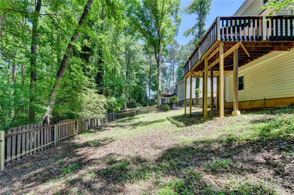 1530 Plunketts Road Buford, GA 30519 - Photo 53 of 54 a view of a house with backyard and trees