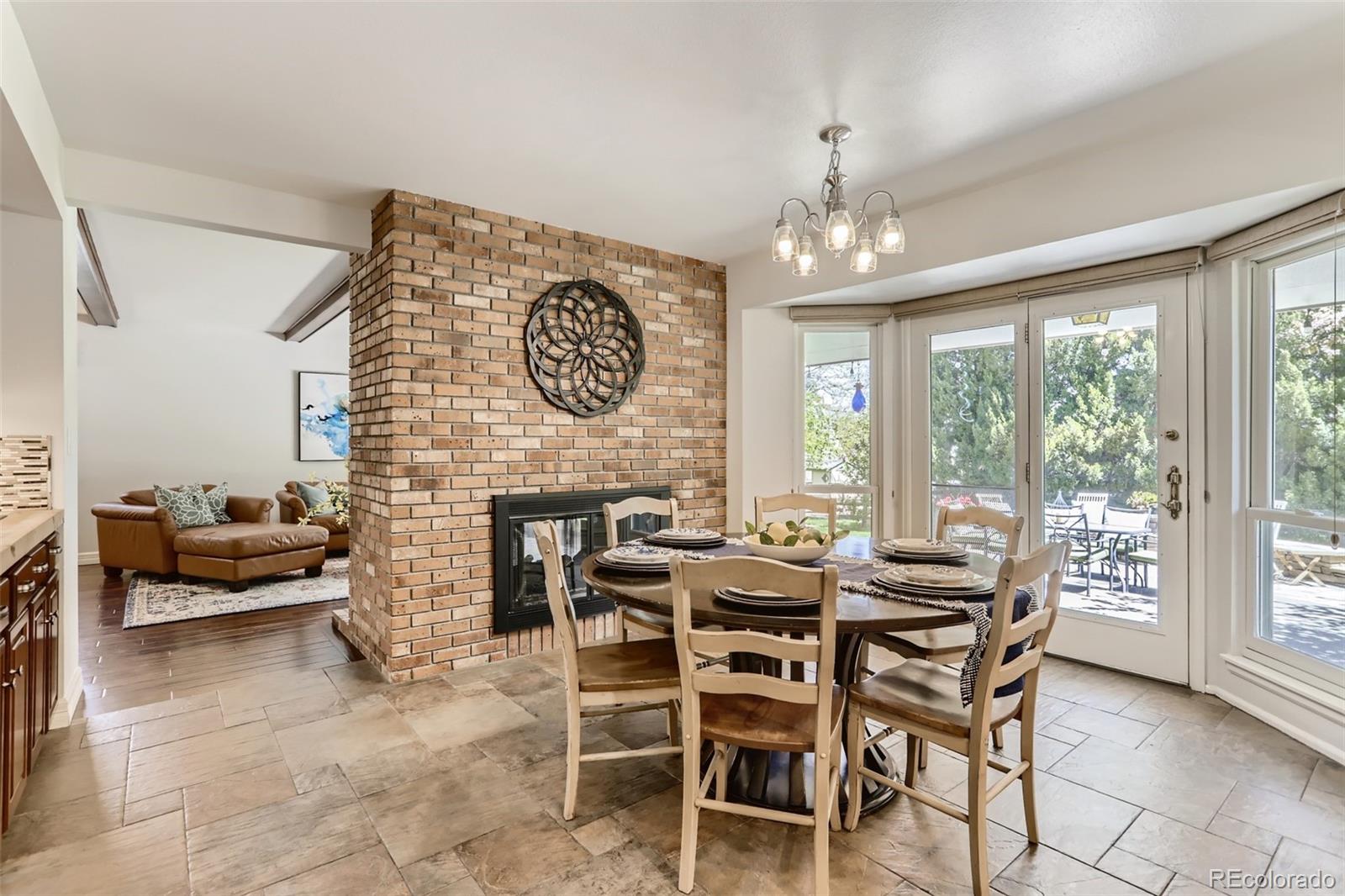 2185 Thistle Ridge Circle Highlands Ranch, CO 80126 - Photo 13 of 37 a view of a dining room with furniture window and outside view