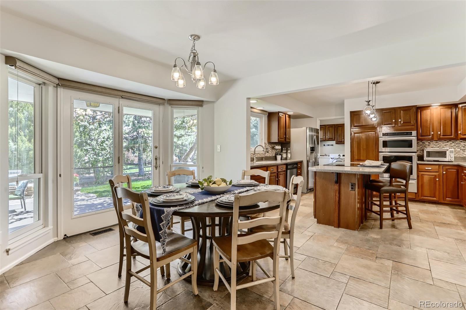 2185 Thistle Ridge Circle Highlands Ranch, CO 80126 - Photo 14 of 37 a view of a dining room with furniture window and outside view