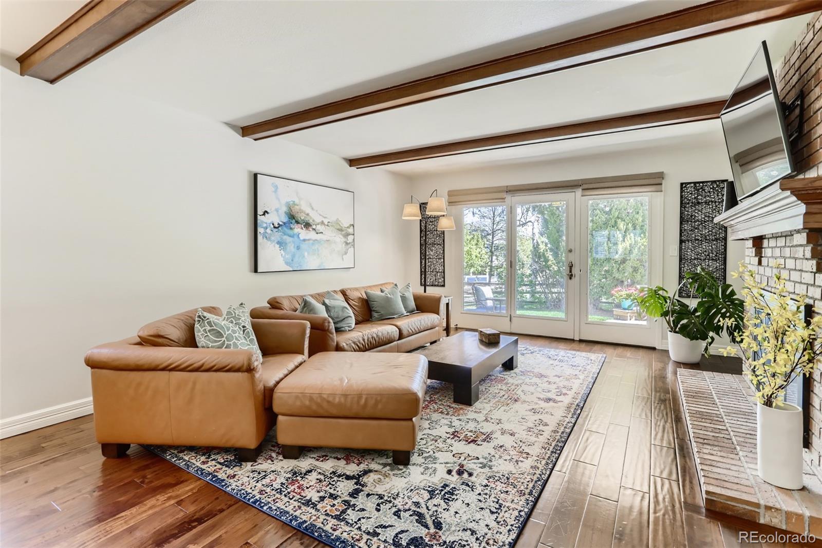 2185 Thistle Ridge Circle Highlands Ranch, CO 80126 - Photo 15 of 37 a living room with furniture and a large window