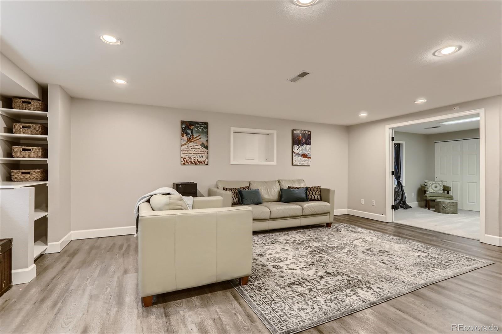 2185 Thistle Ridge Circle Highlands Ranch, CO 80126 - Photo 31 of 37 a living room with furniture and a rug