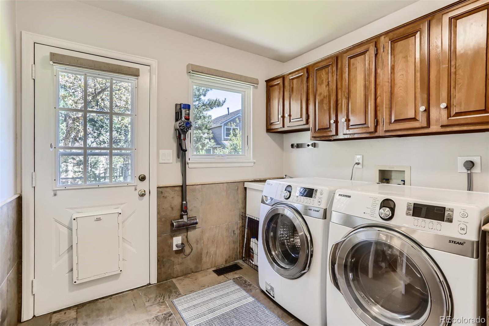 2185 Thistle Ridge Circle Highlands Ranch, CO 80126 - Photo 34 of 37 a view of entryway with washer and dryer