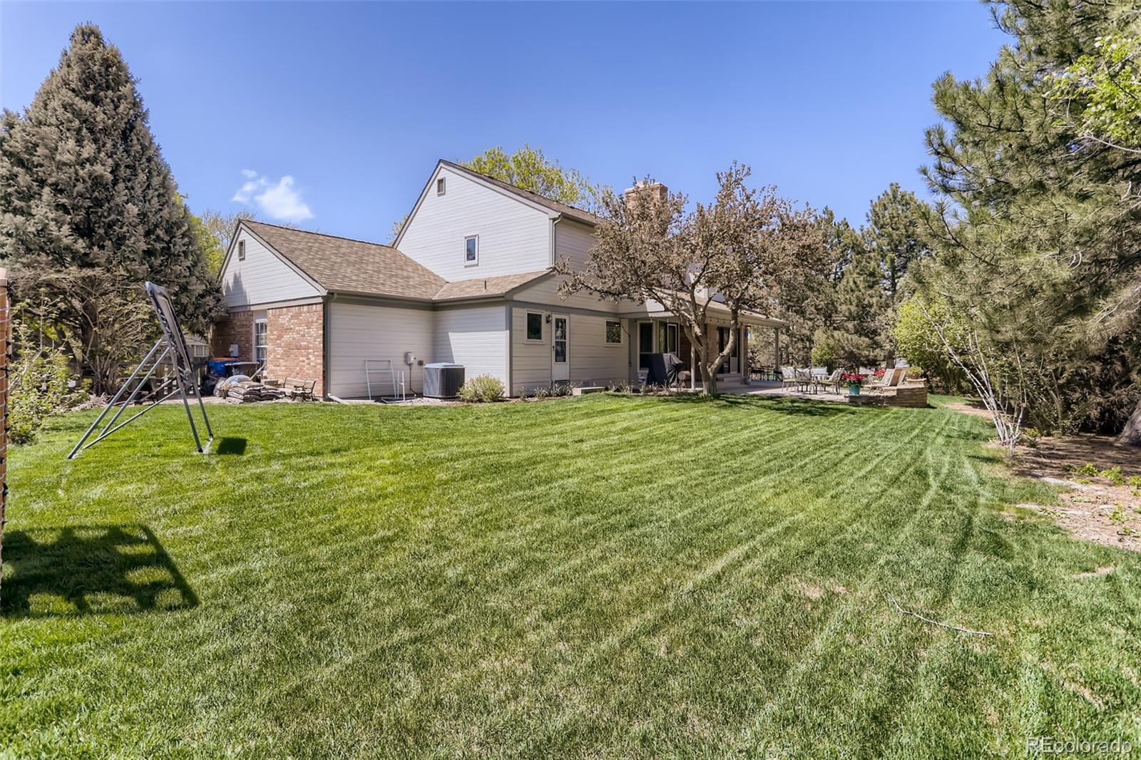 2185 Thistle Ridge Circle Highlands Ranch, CO 80126 - Photo 36 of 37 a view of a house with a yard
