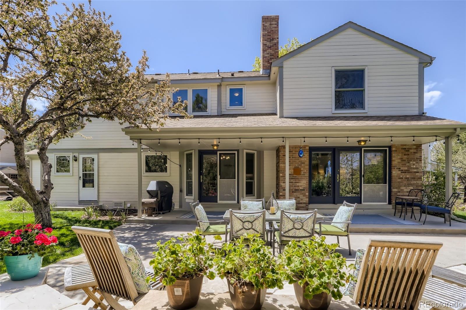 2185 Thistle Ridge Circle Highlands Ranch, CO 80126 - Photo 37 of 37 a view of a house with a sitting area and garden