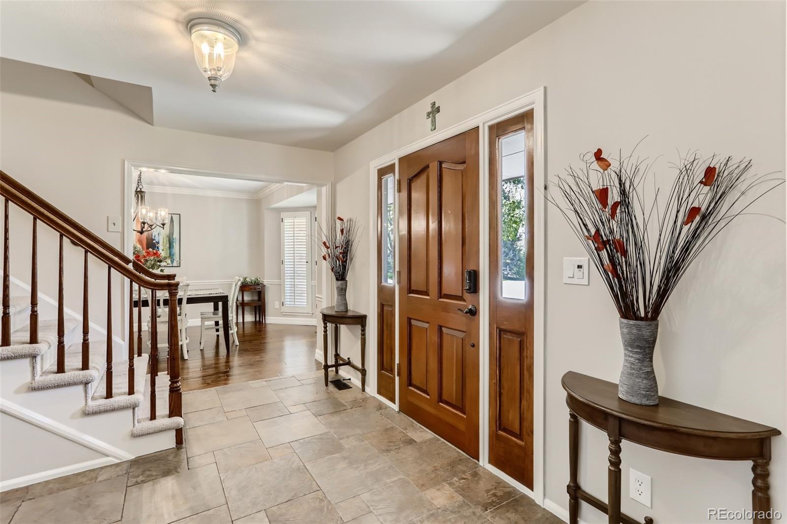 2185 Thistle Ridge Circle Highlands Ranch, CO 80126 - Photo 4 of 37 a view of a hallway with furniture and stairs