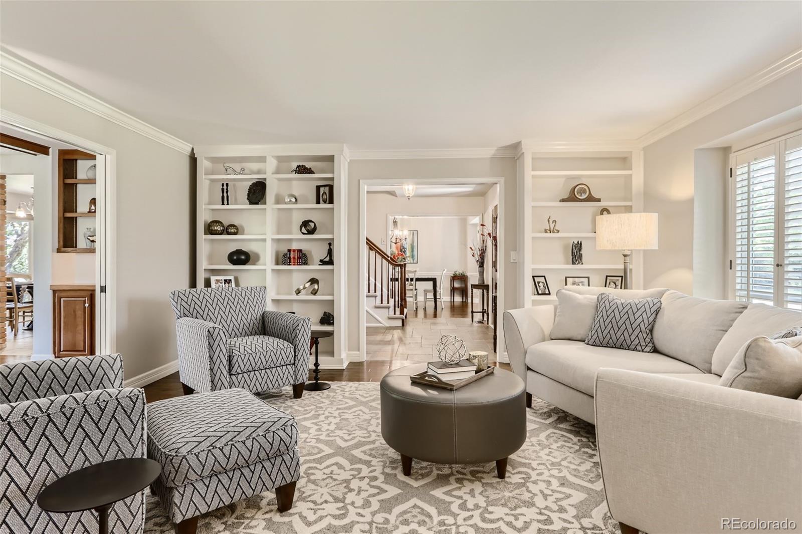 2185 Thistle Ridge Circle Highlands Ranch, CO 80126 - Photo 6 of 37 a living room with furniture and a potted plant