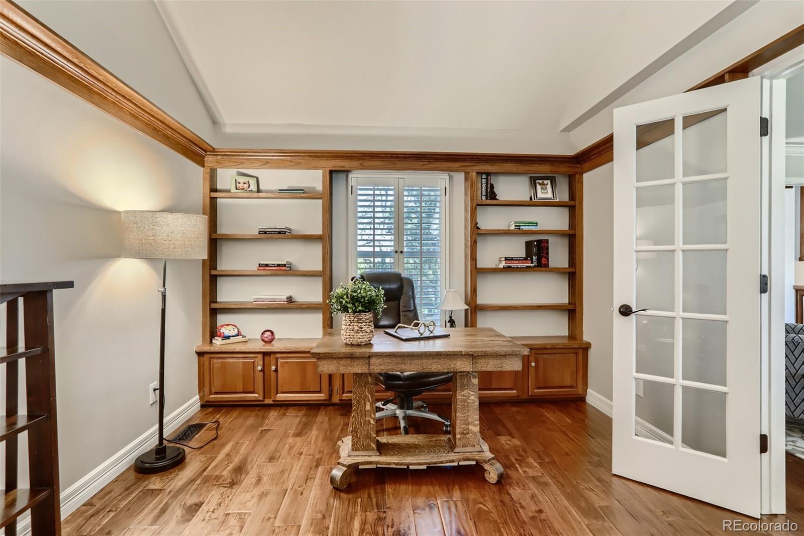 2185 Thistle Ridge Circle Highlands Ranch, CO 80126 - Photo 9 of 37 a workspace with furniture window and wooden floor