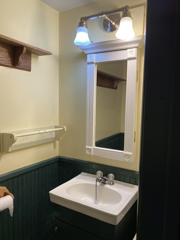 106 Shore Road Becket, MA 01223 - Photo 14 of 29 a bathroom with a sink and a mirror