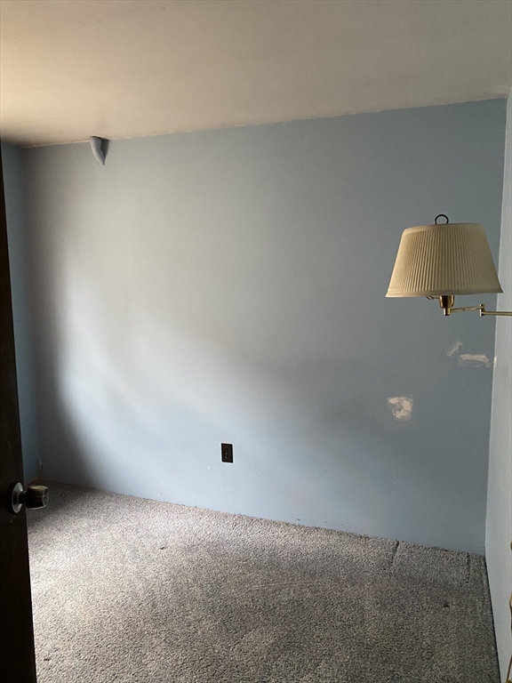 106 Shore Road Becket, MA 01223 - Photo 15 of 29 an empty room with a lamp and a window