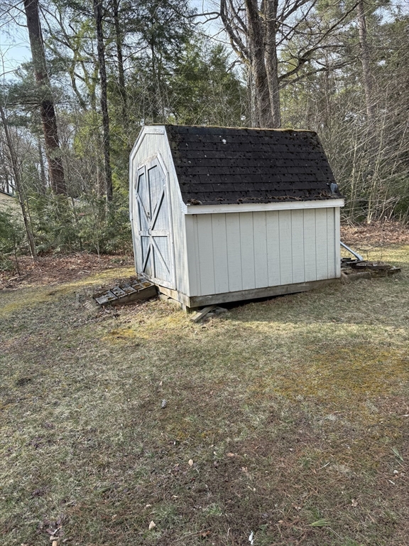 106 Shore Road Becket, MA 01223 - Photo 22 of 29 a view of a backyard with a tree