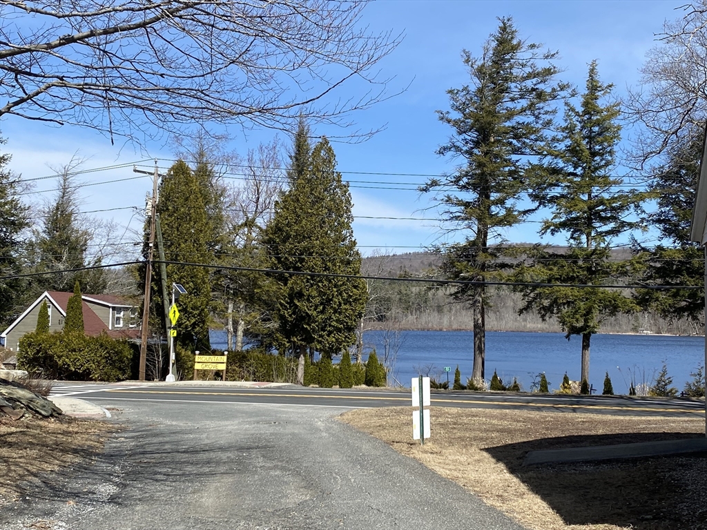 106 Shore Road Becket, MA 01223 - Photo 27 of 29 a house view with a sitting space and trees