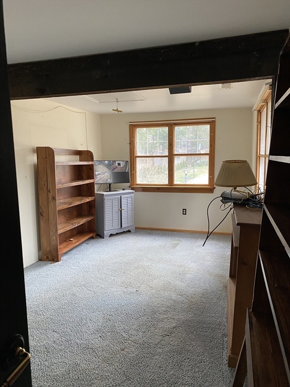 106 Shore Road Becket, MA 01223 - Photo 10 of 29 a room with furniture and a window