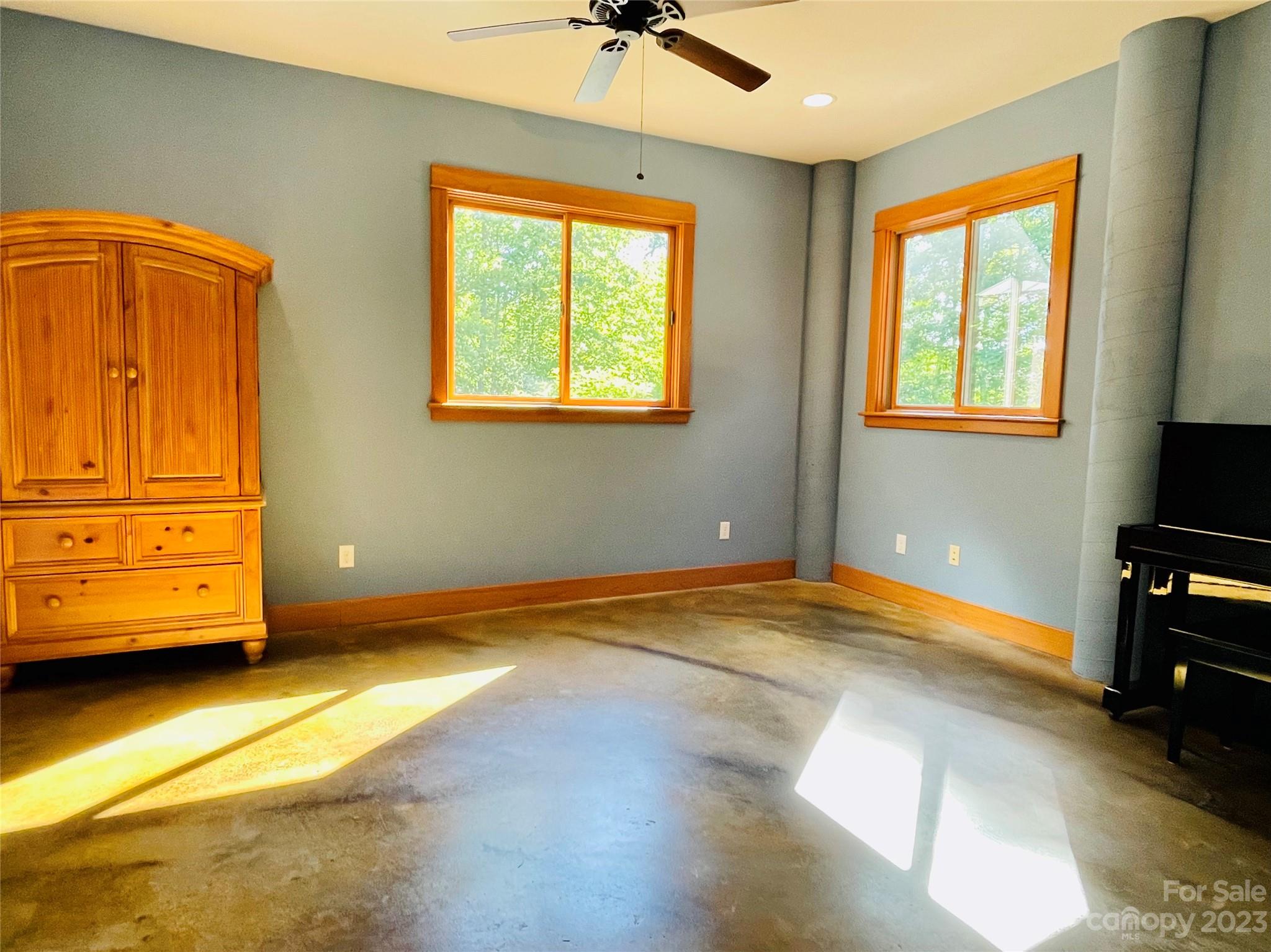 204 Hooker Road Tryon, NC 28782 - Photo 12 of 34 a bedroom with a bed and wooden floor
