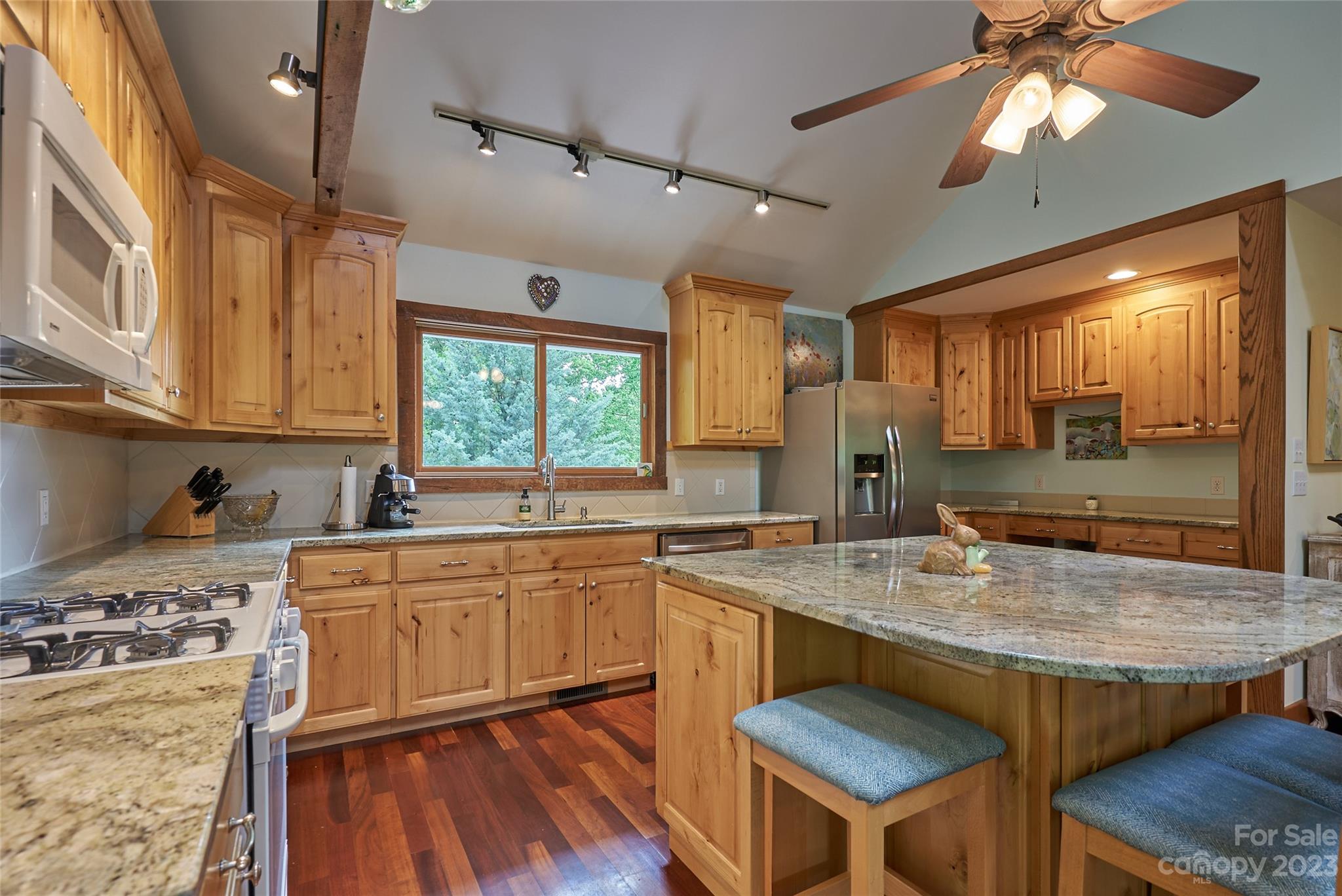 204 Hooker Road Tryon, NC 28782 - Photo 16 of 34 a kitchen with a stove a sink and a refrigerator