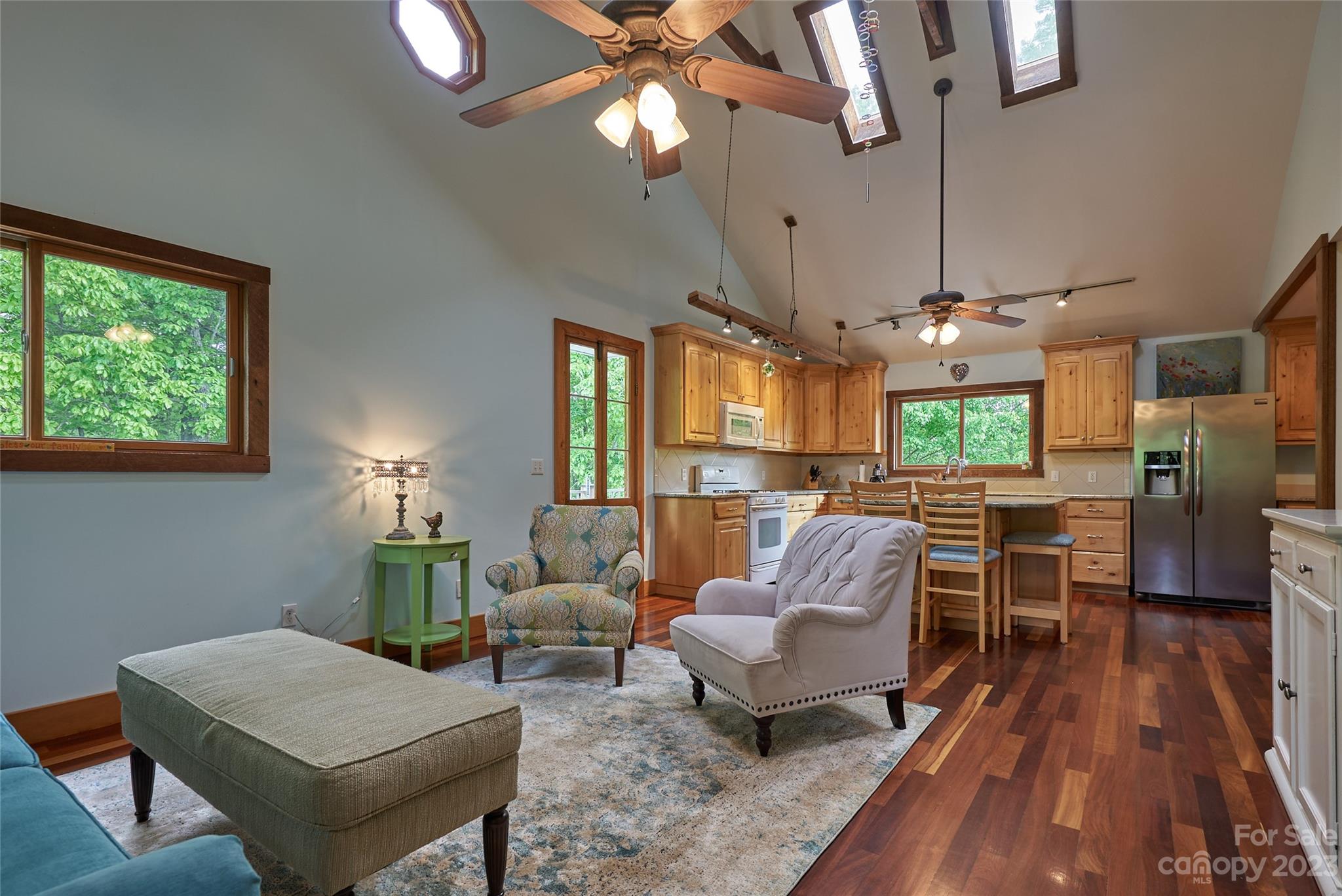 204 Hooker Road Tryon, NC 28782 - Photo 18 of 34 a living room with furniture and a chandelier