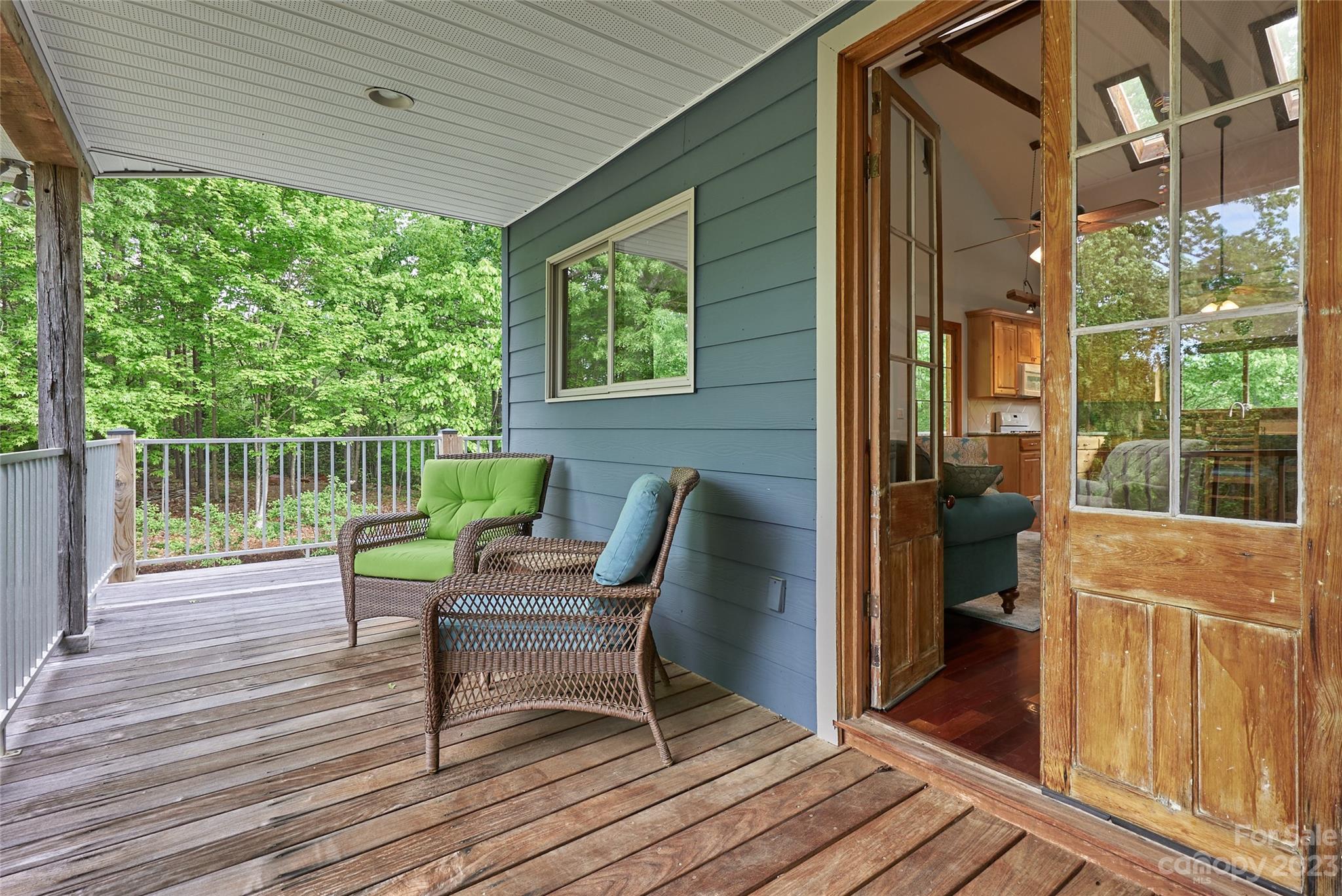 204 Hooker Road Tryon, NC 28782 - Photo 19 of 34 a view of a deck with chair and wooden floor