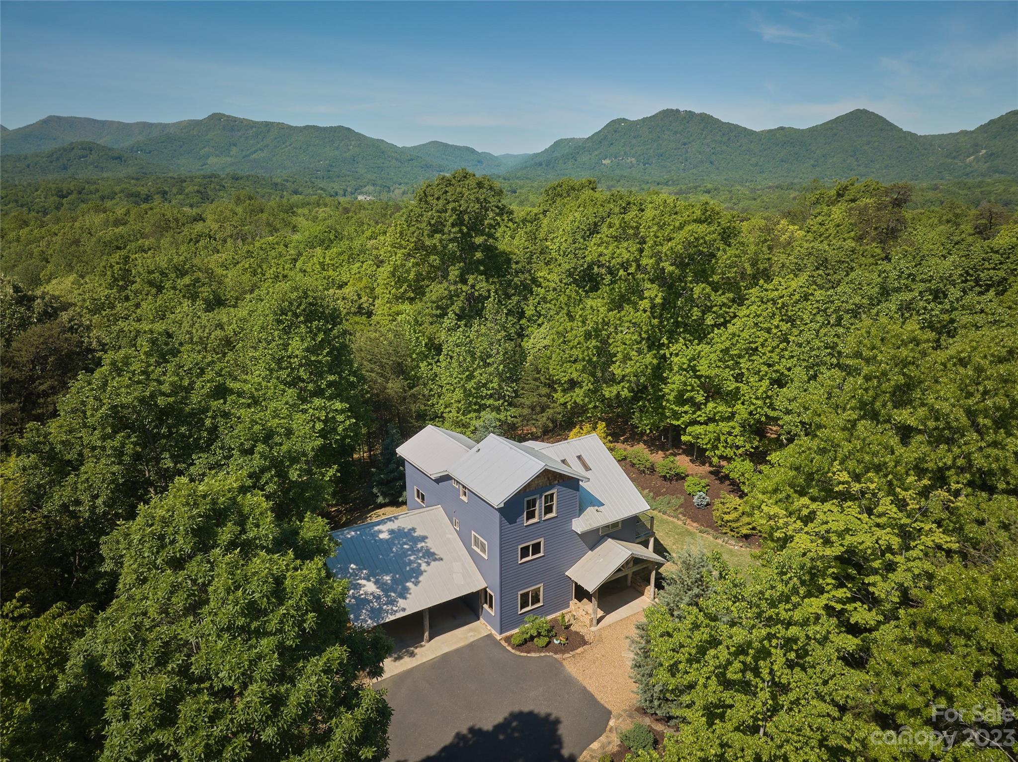 204 Hooker Road Tryon, NC 28782 - Photo 2 of 34 an aerial view of a house with a garden