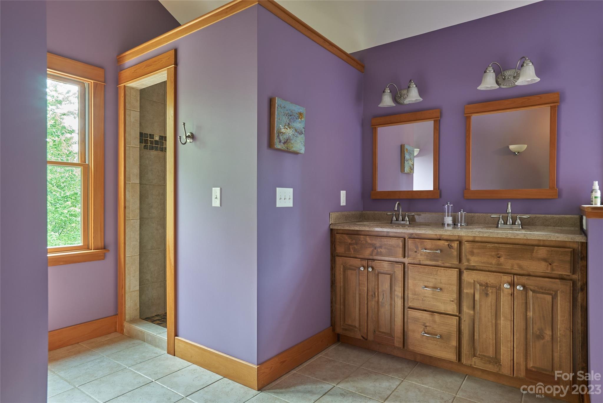 204 Hooker Road Tryon, NC 28782 - Photo 21 of 34 a bathroom with a granite countertop sink a mirror and a window