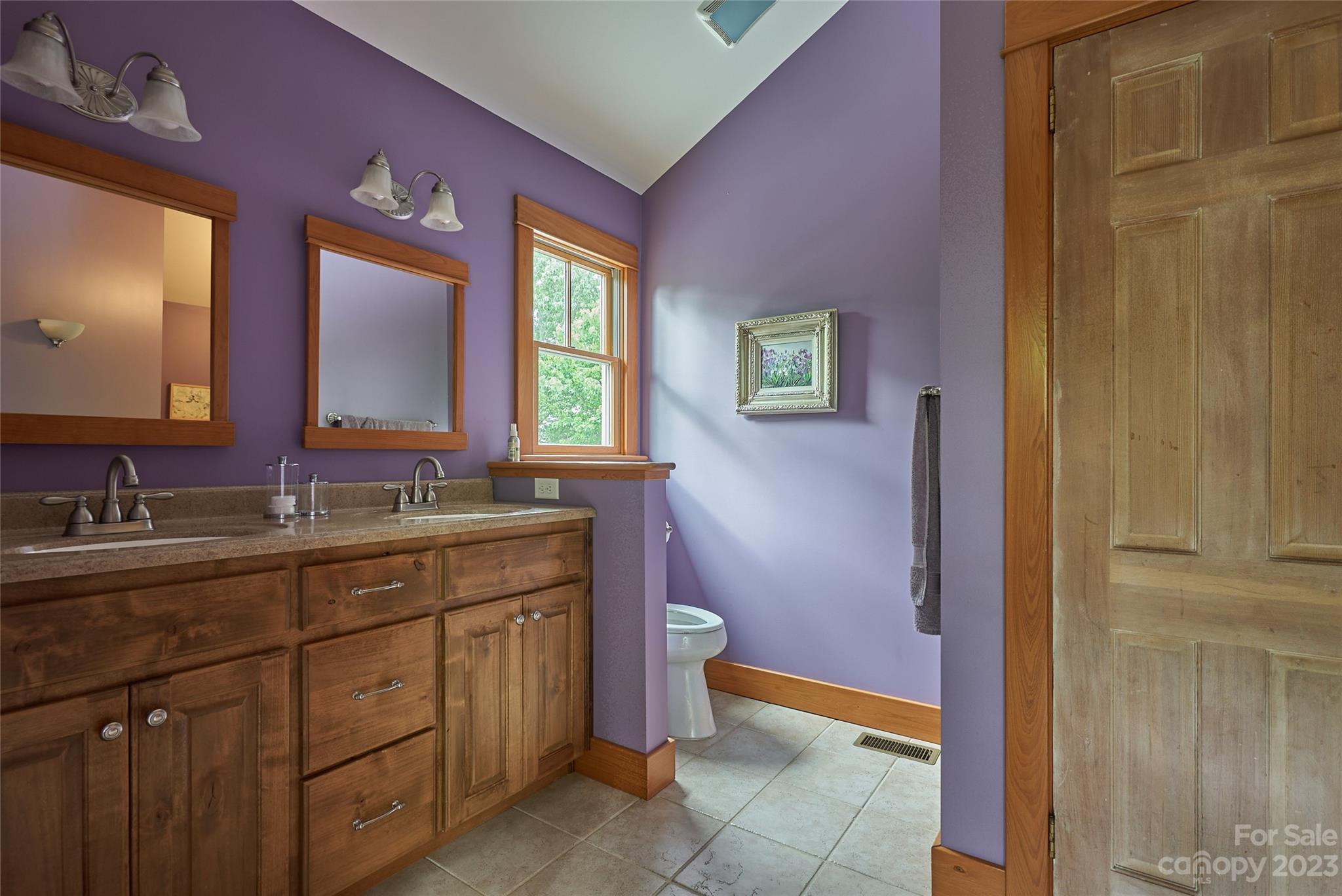 204 Hooker Road Tryon, NC 28782 - Photo 22 of 34 a bathroom with a granite countertop sink toilet and mirror