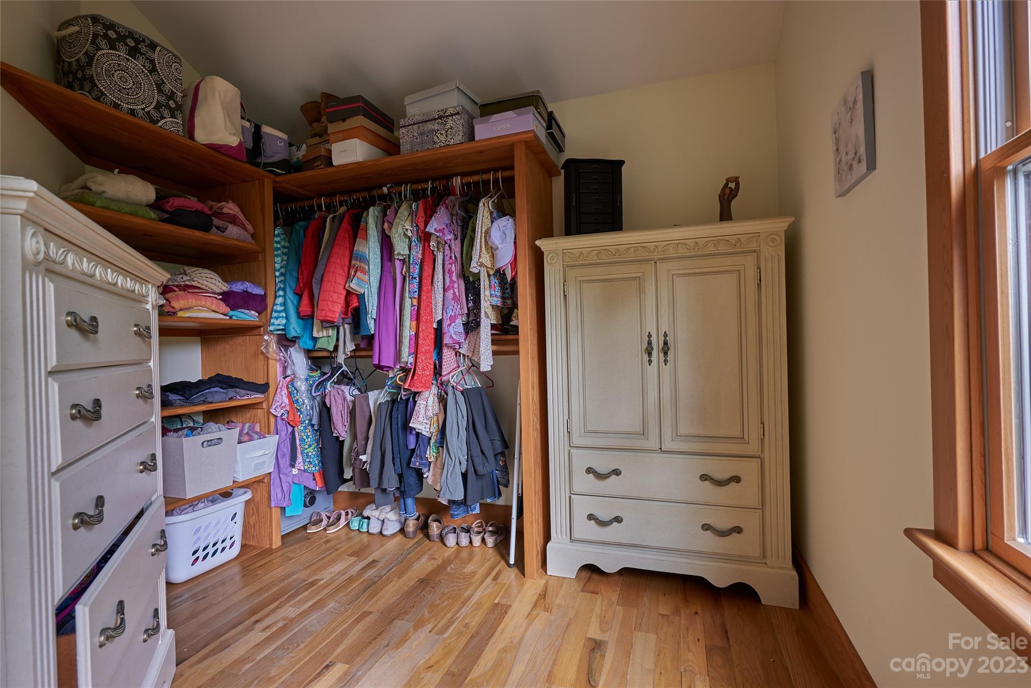 204 Hooker Road Tryon, NC 28782 - Photo 23 of 34 a view of walk in closet with clothes and shoes