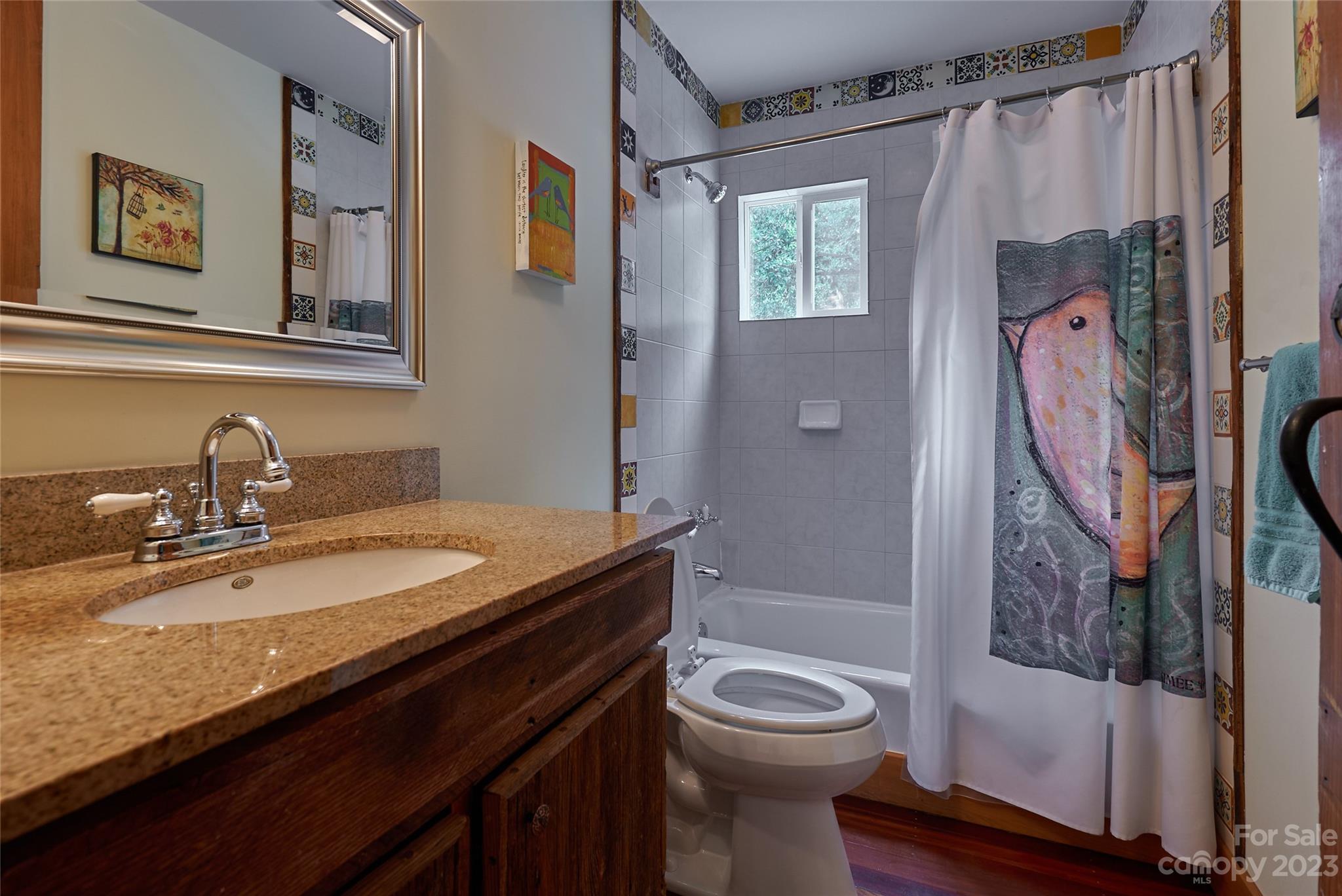 204 Hooker Road Tryon, NC 28782 - Photo 25 of 34 a bathroom with a granite countertop sink toilet and shower