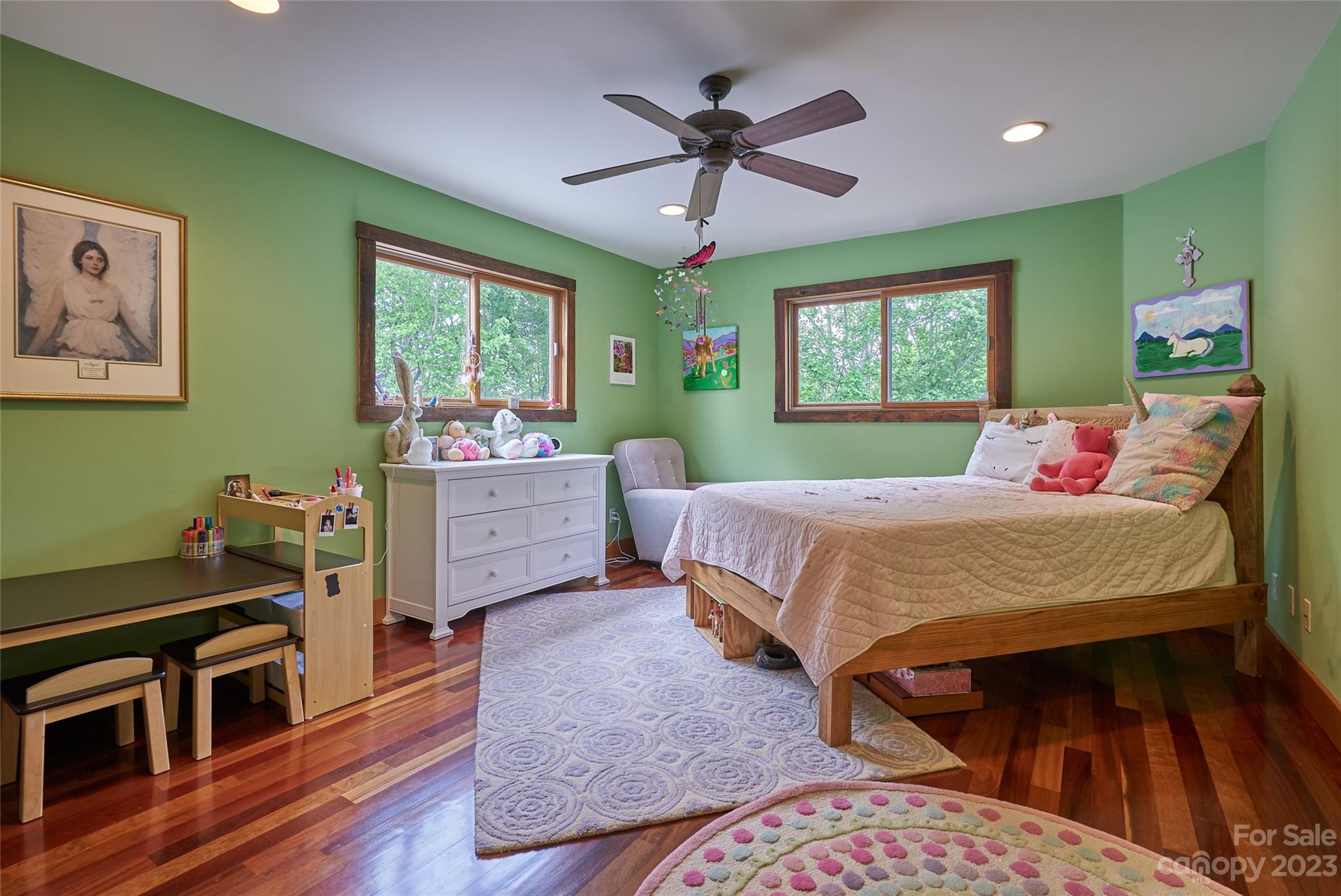 204 Hooker Road Tryon, NC 28782 - Photo 26 of 34 a bedroom with a bed and a chandelier