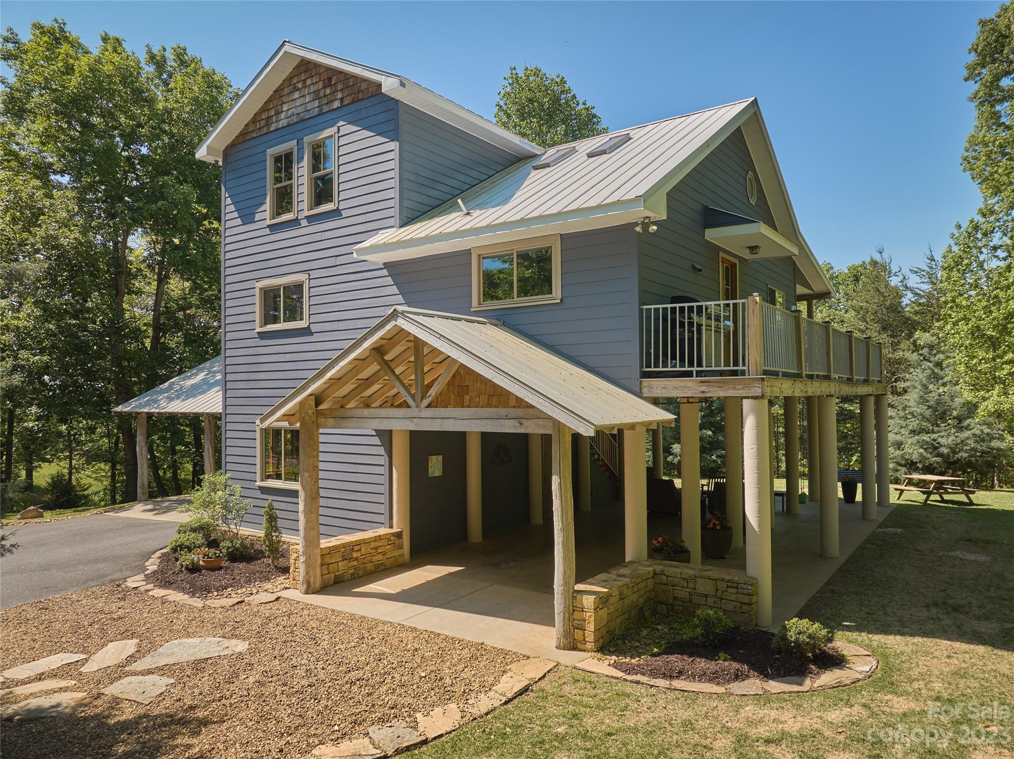 204 Hooker Road Tryon, NC 28782 - Photo 4 of 34 a front view of a house with a porch