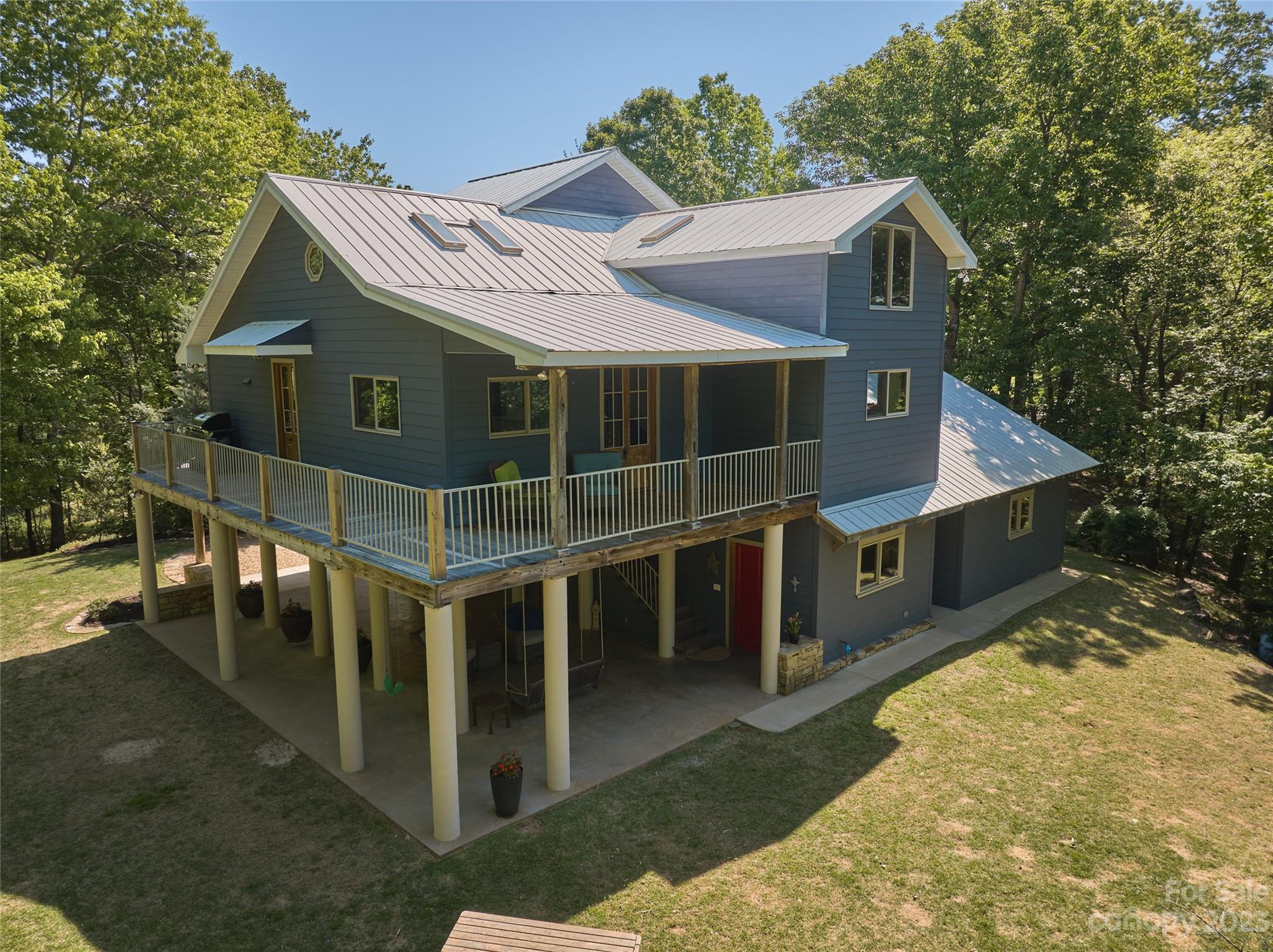 204 Hooker Road Tryon, NC 28782 - Photo 7 of 34 a view of a house with a yard and balcony