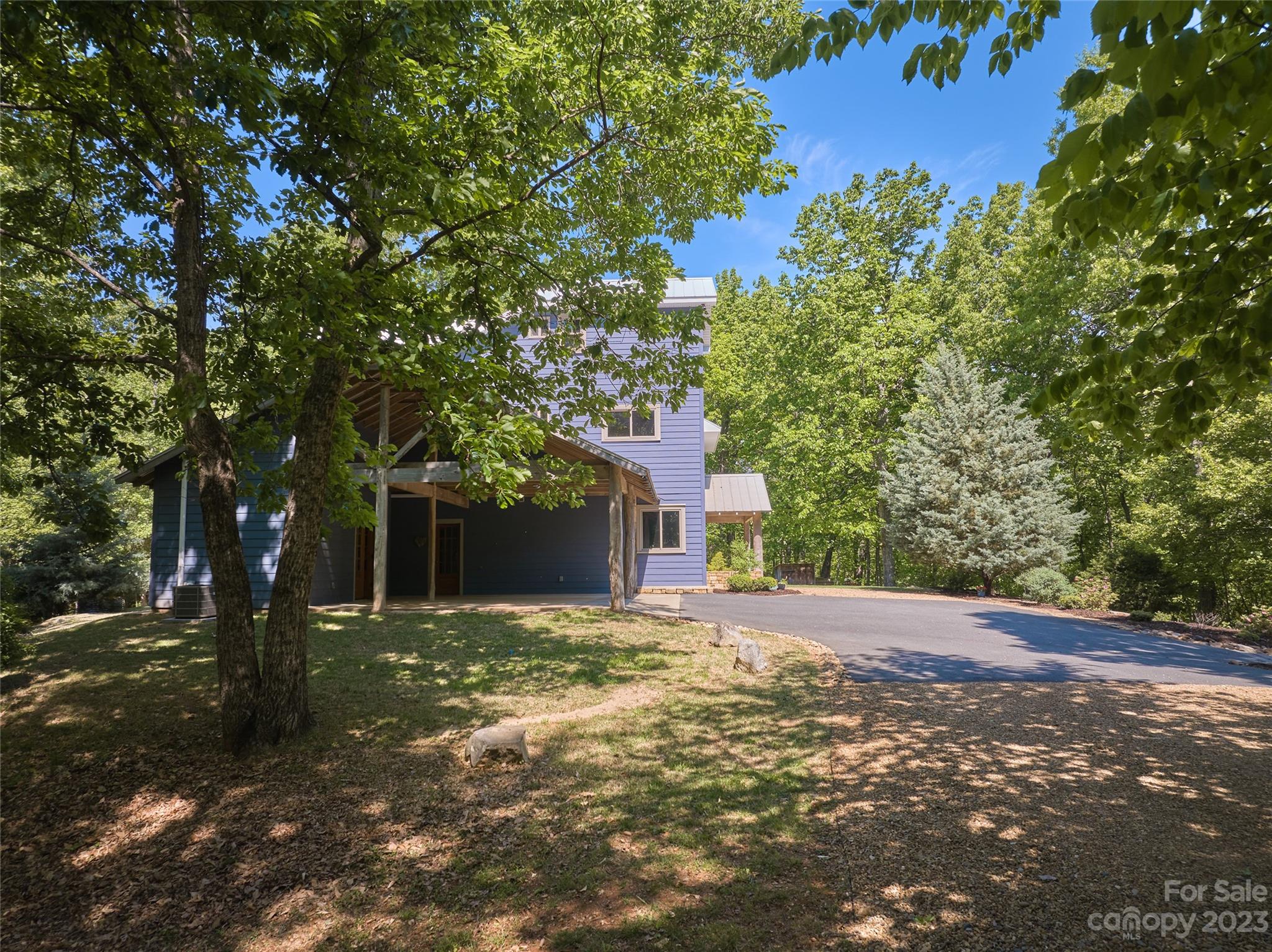 204 Hooker Road Tryon, NC 28782 - Photo 8 of 34 a front view of a house with a yard