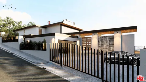 a view of a house with wooden fence