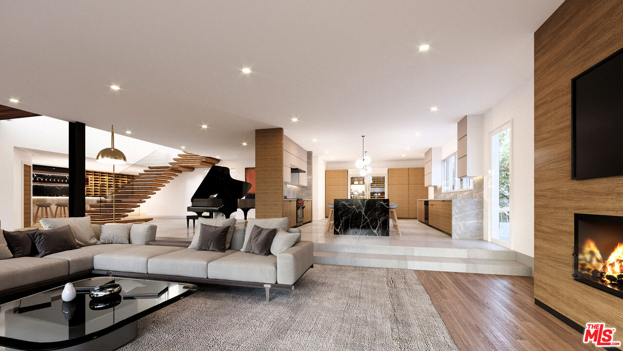 1400 Laurel Way Beverly Hills, CA 90210 - Photo 4 of 6 a living room with furniture and a fireplace