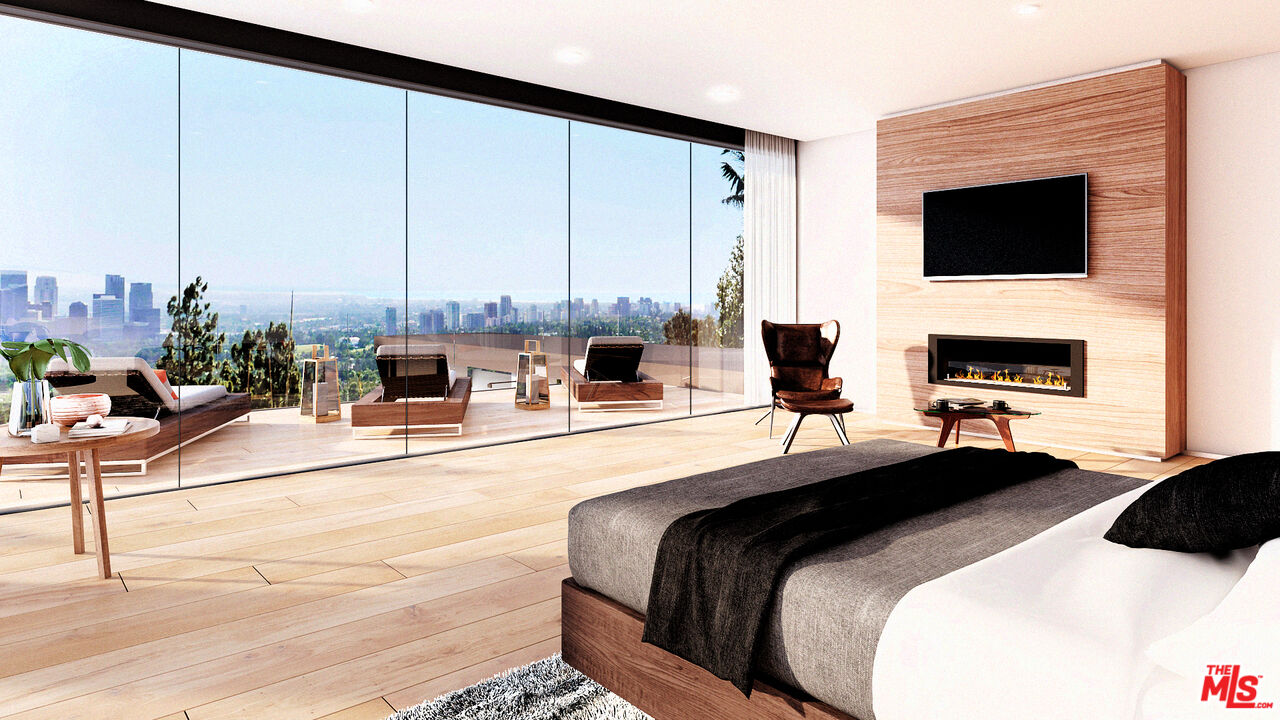 1400 Laurel Way Beverly Hills, CA 90210 - Photo 5 of 6 a large bedroom with a bed a flat screen tv and a fireplace