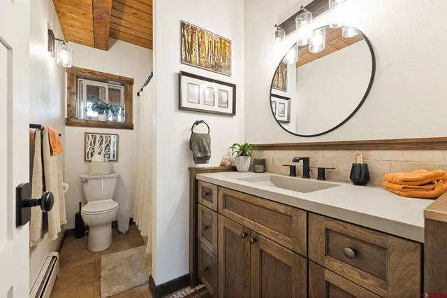 a spacious bedroom with a bed and a window