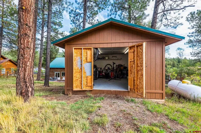 a view of a backyard with sitting area