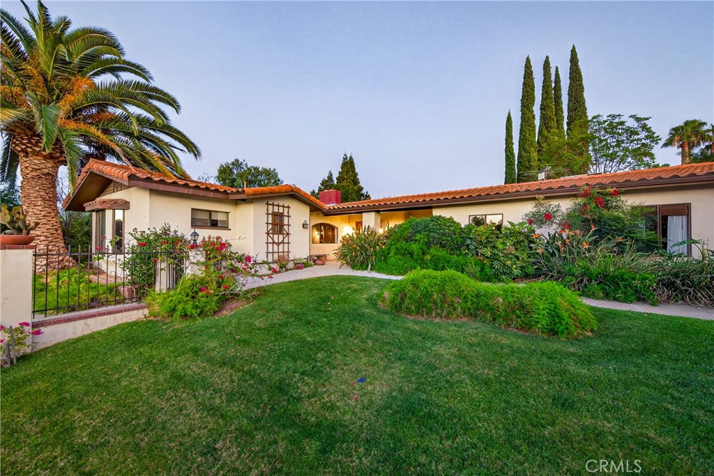 707 Wabash Avenue Redlands, CA 92374 - Photo 2 of 50 a front view of a house with a yard and potted plants