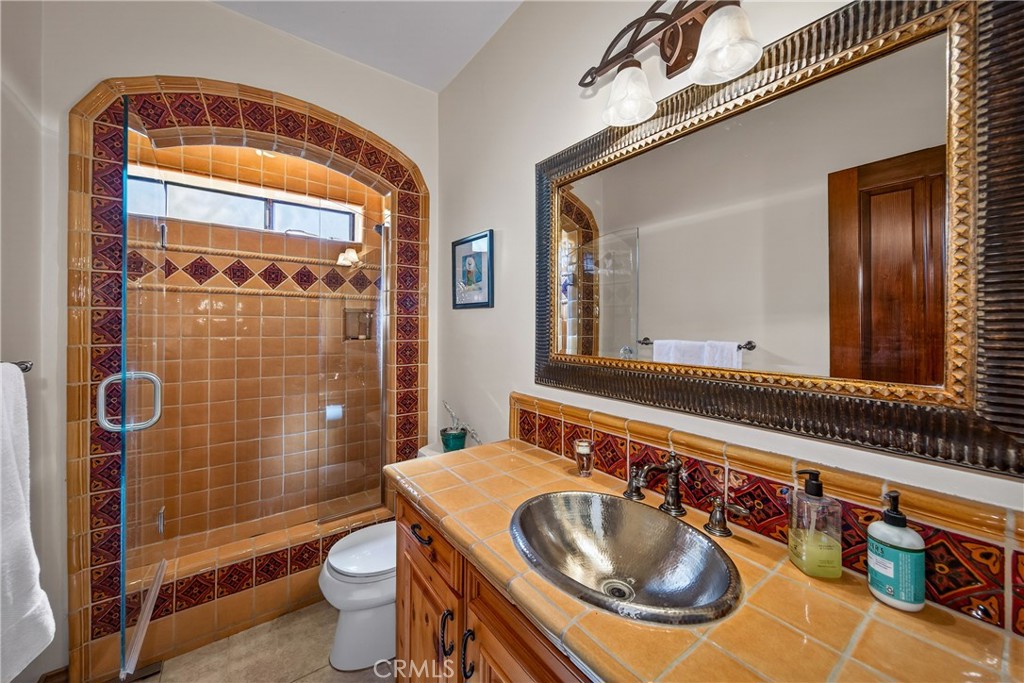 707 Wabash Avenue Redlands, CA 92374 - Photo 26 of 50 a bathroom with a sink toilet and shower