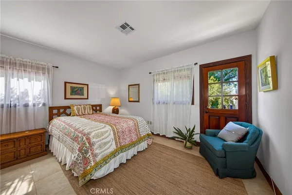 a view of a swimming pool with a patio and a yard