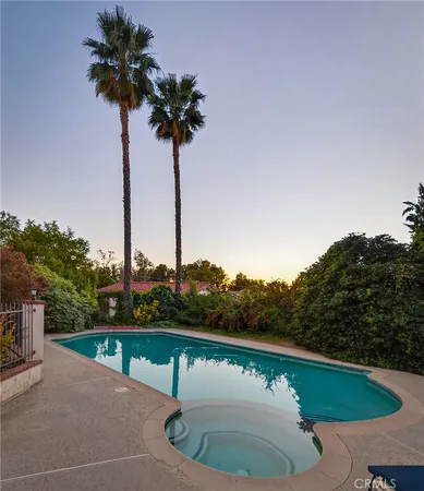 a view of a house with a yard and garden