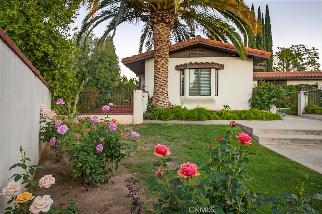 707 Wabash Avenue Redlands, CA 92374 - Photo 32 of 50 a view of a house with a yard and garden