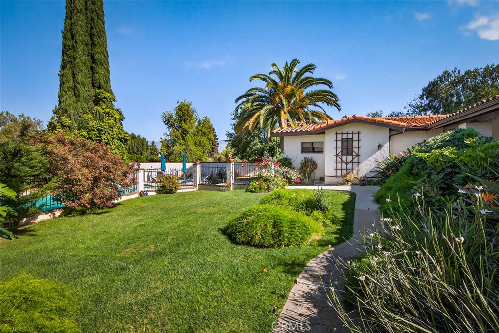 707 Wabash Avenue Redlands, CA 92374 - Photo 4 of 50 a view of a house with a yard and potted plants