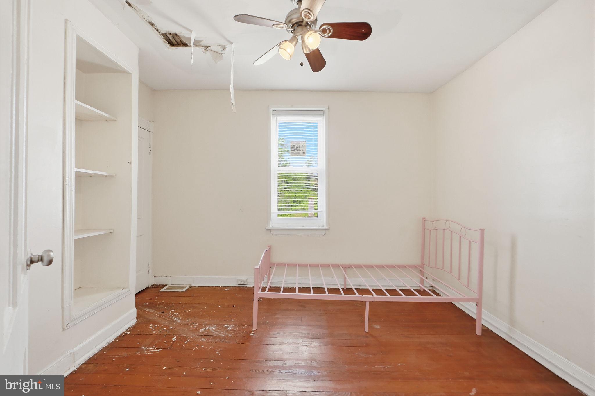3449 Old Frederick Road Baltimore, MD 21229 - Photo 15 of 25 Bright, airy room with potential charm.