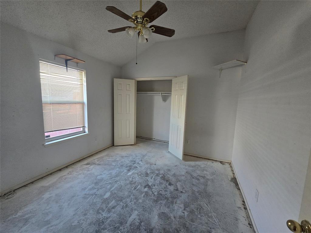 8012 Ashridge Road Fort Worth, TX 76134 - Photo 15 of 18 a view of an empty room with a window