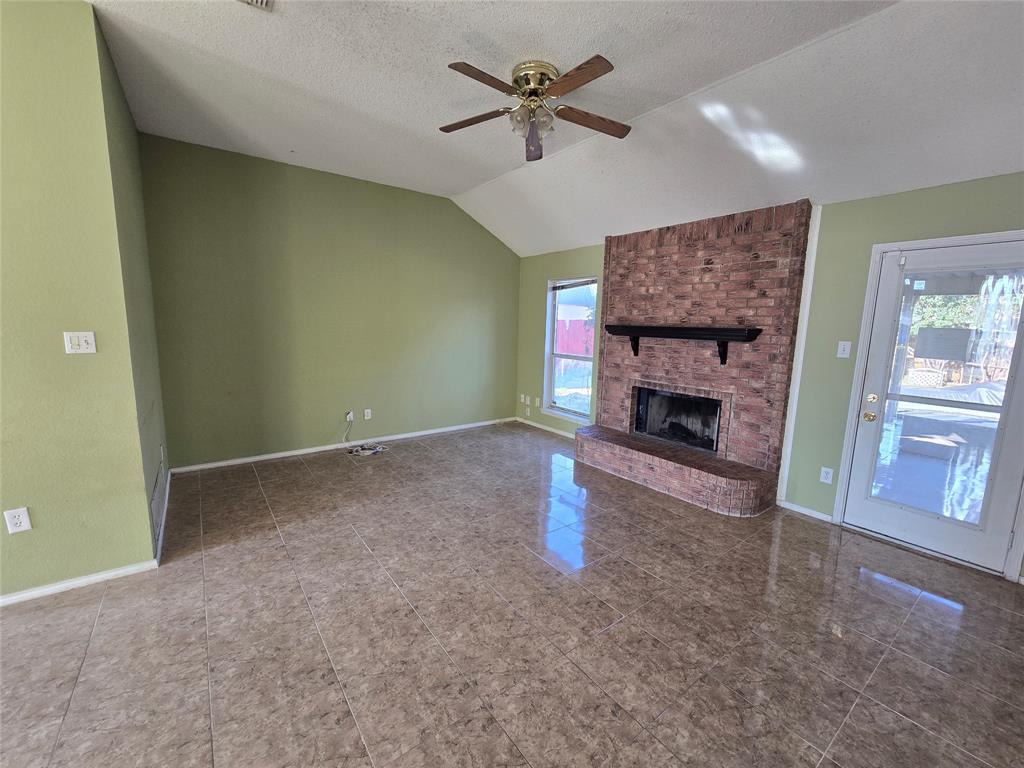 8012 Ashridge Road Fort Worth, TX 76134 - Photo 3 of 20 a living room with furniture and a fireplace