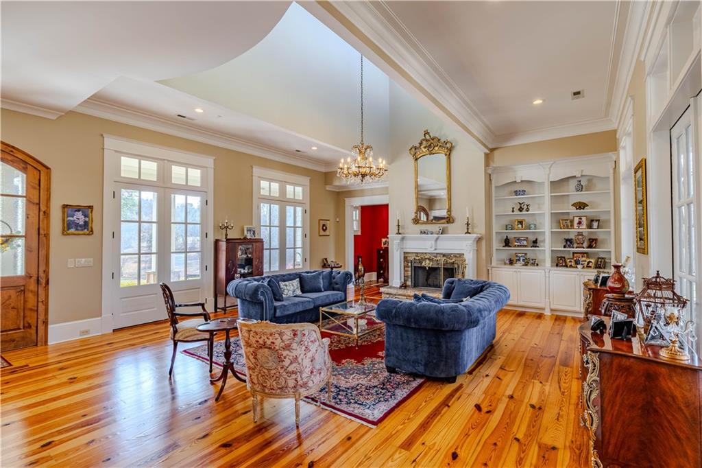 525 North River Road Northeast Rome, GA 30161 - Photo 14 of 101 a living room with fireplace furniture and a wooden floor