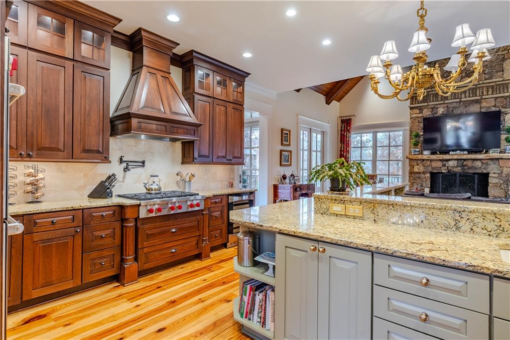 525 North River Road Northeast Rome, GA 30161 - Photo 17 of 101 a kitchen with stainless steel appliances granite countertop a stove a sink and a white cabinets
