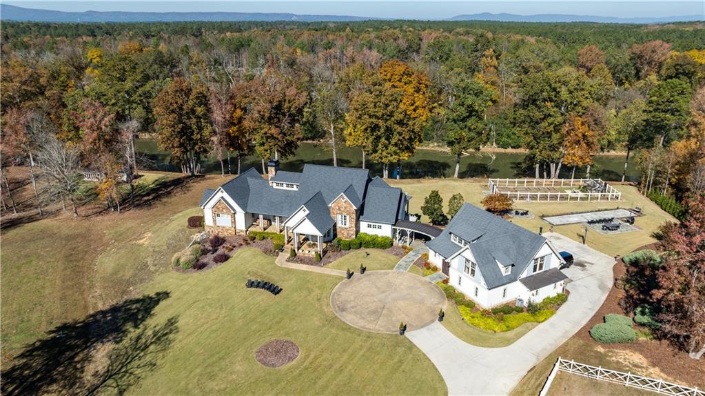 525 North River Road Northeast Rome, GA 30161 - Photo 2 of 101 an aerial view of a swimming pool with seating area