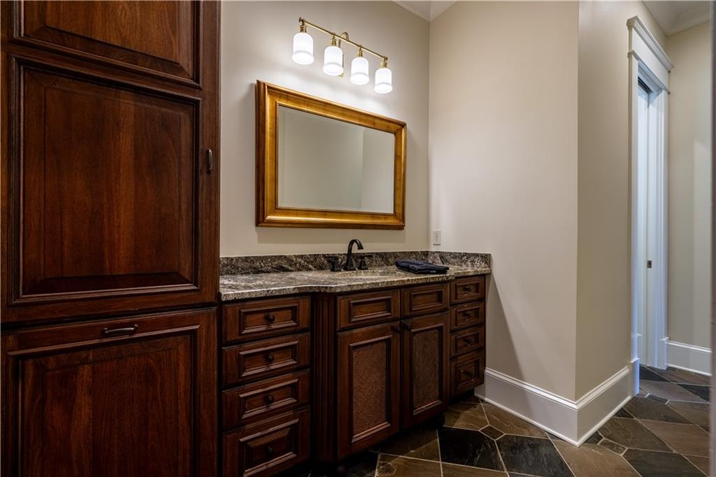 525 North River Road Northeast Rome, GA 30161 - Photo 30 of 101 a bathroom with a sink and a mirror